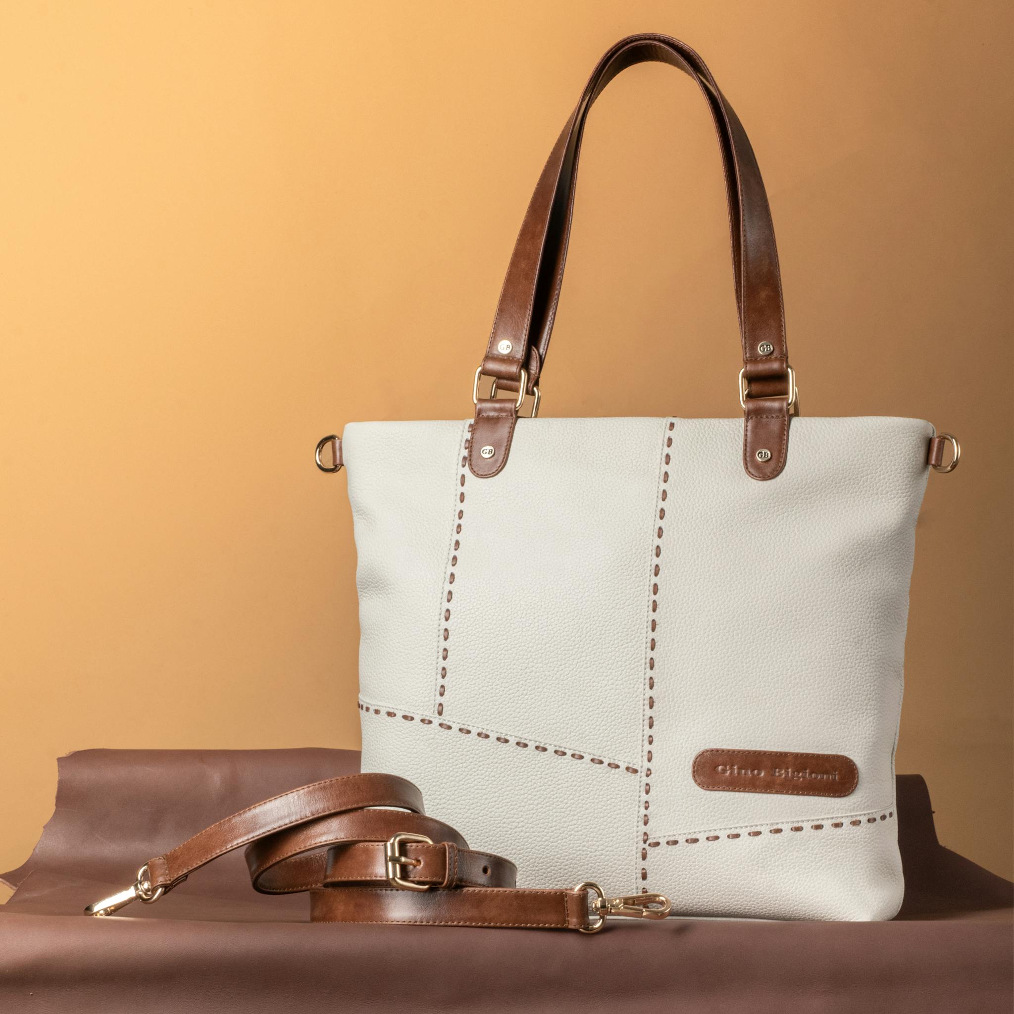 Stylish leather handbag with brown accents, perfect for fashion enthusiasts.